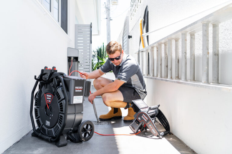 Synergy Trades Group - Plumbers in Action - Our plumber is setting up a drain camera and a pipe leak detector