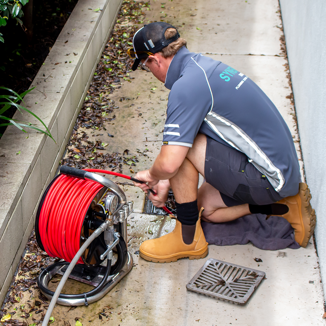 Synergy Trades Group - Plumbers in Action - Our plumber is doing a pipe leak detection job