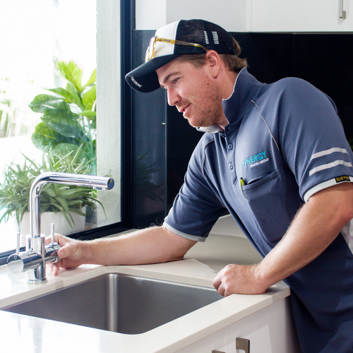 Synergy Trades Group - Plumbers in Action - Our sunshine coast plumber is fixing tap and washer