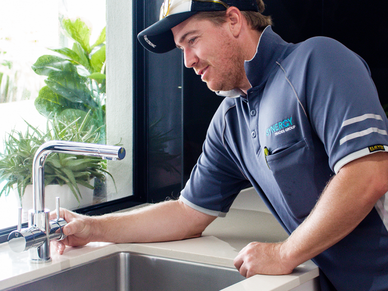 Synergy Trades Group - Plumbers in Action - Our sunshine coast plumber is fixing tap and washer