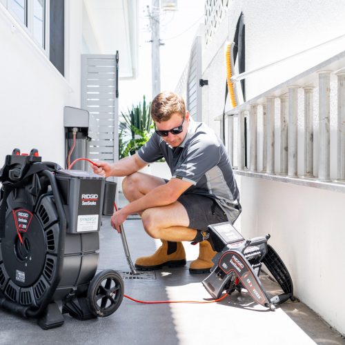 Synergy Trades Group - Plumbers in Action - Our plumber is setting up a drain camera and a pipe leak detector