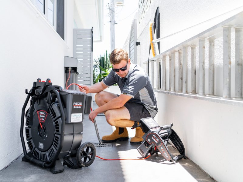 Synergy Trades Group - Plumbers in Action - Our plumber is setting up a drain camera and a pipe leak detector