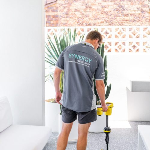 Synergy Trades Group - Plumbers in Action - Our plumber is using a pipe and cable water leak detector carefully